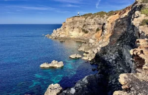 Cala d’Hort Natural Park coastline with view of Es Vedrà