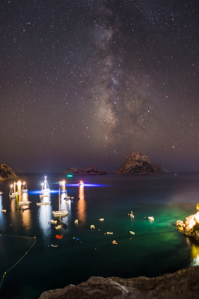 UFO lights above Es Vedra island at night representing mystery and legends